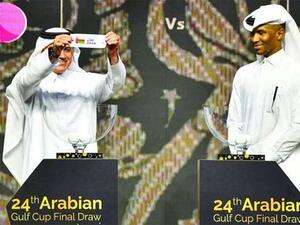 Former Qatari football captains Adel Malallah (L) and Belal Mohamed conduct the draw for the 24th Arabian Gulf Cup at the Marsa Malaz Kempinski, The Pearl – Doha on Wednesday.