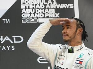 Mercedes' Lewis Hamilton celebrates after winning the final race of the Abu Dhabi Formula One Grand Prix at the Yas Marina Circuit. - Photo by Ryan Lim