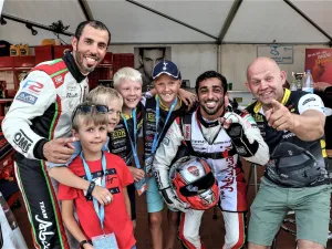 Frode Sundsdal (right) with Rashed Al Qemzi, Rashid Al Tayer (left) and young fans at the Grand Prix of Norway earlier this year. (Supplied photo)