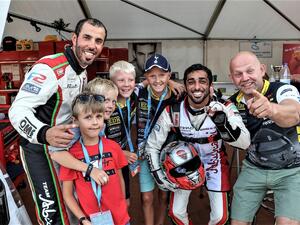 Frode Sundsdal (right) with Rashed Al Qemzi, Rashid Al Tayer (left) and young fans at the Grand Prix of Norway earlier this year. (Supplied photo)