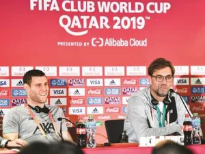 Liverpool manager Jurgen Klopp (right) speaks at a press conference as player James Milner looks on on the eve of the semi-final against Monterrey in Doha. Photo: Noushad Thekkayil