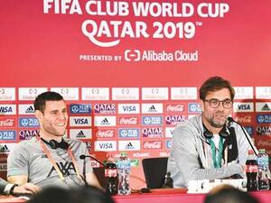 Liverpool manager Jurgen Klopp (right) speaks at a press conference as player James Milner looks on on the eve of the semi-final against Monterrey in Doha. Photo: Noushad Thekkayil