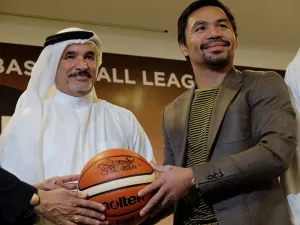 Manny Pacquiao presenting signed basketball to Saeed Hareb, Director General Dubai Sports Council at the Dubai Sports Council office (KT file)