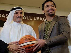 Manny Pacquiao presenting signed basketball to Saeed Hareb, Director General Dubai Sports Council at the Dubai Sports Council office (KT file)