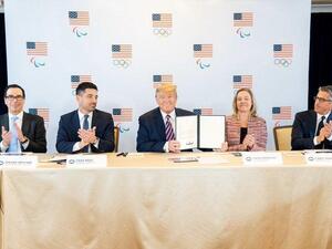 President Donald Trump signs a document Tuesday in Los Angeles supporting its hosting of the 2028 Olympic Summer Games. (Photo: White House Press Secretary Stephanie Grisham/Twitter)