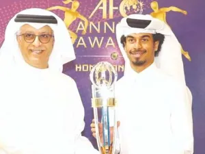 Qatar’s Akram Afif (R) receives the AFC Player of the Year Award from AFC President Sheikh Salman bin Ebrahim al-Khalifah