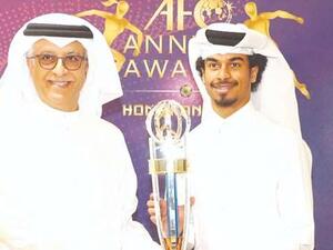 Qatar’s Akram Afif (R) receives the AFC Player of the Year Award from AFC President Sheikh Salman bin Ebrahim al-Khalifah
