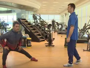 Rally driver Nasser Saleh al-Attiyah (left) stretches during Aspetar’s online training session.
