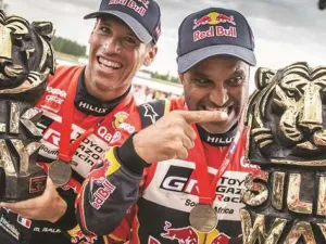 Qatar’s ace rally driver Nasser al-Attiyah (right) and his co-driver Mathieu Baumel of France celebrate after winning the Silk Way Rally in Dunhuang, China, on July 16, 2019 (Photo: Gulf Times)