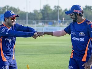 Mumbai Indians' Aditya Tare (left) and teammate Jasprit Bumrah fist bump during a training session. - Mumbai Indians Twitter