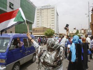 Employees demonstrate outside Bank of Khartoum on May 28, 2019 as they participate in a two-day national strike to step up pressure on the ruling military council. (AFP/File)