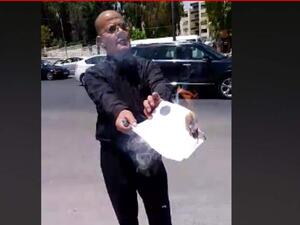 A Jordanian national set fire to his PhD certificate in front of the Prime Ministry building in the capital Amman. (Video Screenshot)