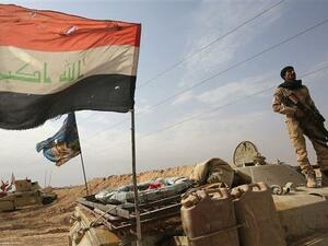 Iraqi forces take position near the Syrian border after recapturing the border town of Qaim in Anbar Province on November 4, 2017. (Photo by AFP)