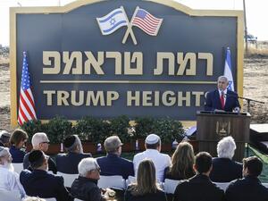 Israeli Prime Minister Benjamin Netanyahu gives a speech before the newly-unveiled sign for the new settlement of "Ramat Trump", or "Trump Heights" in English, named after the incumbent US President during an official ceremony in the Israeli-annexed Golan Heights on June 16, 2019. (AFP/ File Photo)