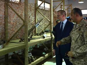 Brian Hook (R), the US special representative on Iran, walks past what Saudi officials said were Iranian-made weapons used by the Huthi rebels in Yemen, during a visit to an army base in al-Kharj, south of the Saudi capital Riyadh, on June 21, 2019. (AFP)