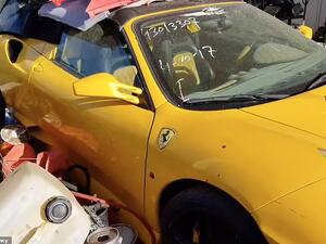 A bright yellow Ferrari is covered with assorted pieces of plastic waste and has a date written on its front windscreen at the yard full of abandoned vehicles in Sharjah in the UAE. (Daily Mail)