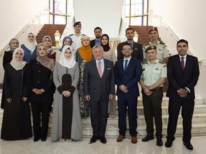 King Abdullah II meets with a group of young people he previously met 17 years ago during the first school trip to Raghadan Palace. (Twitter/ @RHCJO)