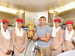 Bryan Habana on board Emirates flight EK 318 with the Webb Ellis Cup on its way to Japan