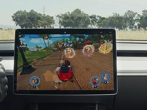 Tesla will launch a new downloadable video game, Beach Buggy Racing 2, Tuesday that will use the actual steering wheel and brake pedal when the vehicle is in park. (Photo from Tesla/Tesa.com)
