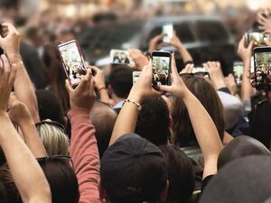 Crowds with Smartphones on Street