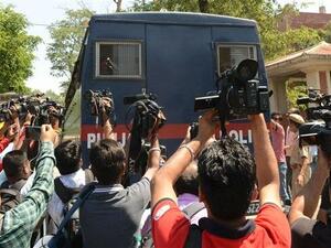 Media gather as a police vehicle carrying seven men accused for the rape and murder of an eight-year-old girl, arrives at a court in Pathankot, in the northern state of Punjab, on June 10, 2019. (AFP/ File Photo)