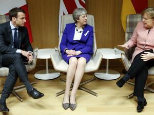 UK PM Theresa May, German Chancellor Angela Merkel and France's Emmanuel Macron at a press conference in Brussels on 22 March 2018. (AFP/ File Photo)