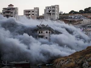 Demolition of a Palestinian building which was under construction, in the the Palestinian village of Sur Baher in East Jerusalem (AFP)