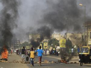 Demonstrators burn tires in the middle of a main street in Khartoum on July 27, 2019, as they protest against the results of the probe into the June raid on a Khartoum protest camp revealed. (AFP/ File Photo)