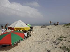 People enjoy a day on the Palm Island natural reserve near the coast of the Mina district of Tripoli in northern Lebanon on May 27, 2018. ( AFP / IBRAHIM CHALHOUB)