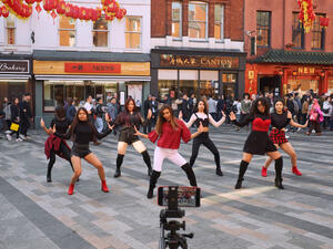 A K-Pop band films a video in Chinatown, London. (Shutterstock/ File Photo)