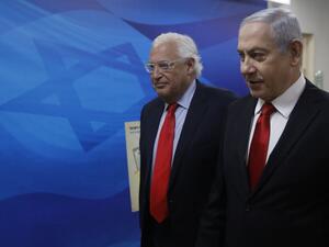 Israeli Prime Minister Benjamin Netanyahu (R) and US Ambassador to Israel David Friedman (AFP)