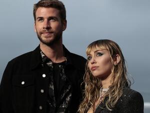 US singer Miley Cyrus and husband Australian actor Liam Hemsworth arrive for the Saint Laurent Men's Spring-Summer 2020 runway show in Malibu, California. (AFP/ File)