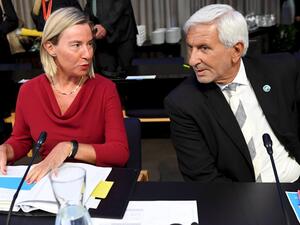 High Representative of the European Union for Foreign Affairs and Security Policy and Vice-President of the European Commission Federica Mogherini (L) and General Director of EU Council Leonardo Schiavo  (AFP)