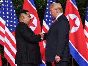 North Korean leader Kim Jong Un shakes hands with US President Donald Trump at the start of their summit in Singapore on Tuesday, June 12. (Saul Loeb/AFP/Getty Images)