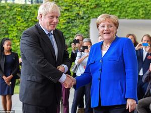 Boris Johnson was greeted by Angela Merkel in Berlin this afternoon as he arrived in Germany for showdown Brexit talks (AFP/ File Photo)