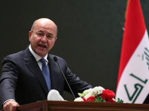 Iraqi President Barham Salih delivering a speech on 2 October, 2018 at the parliament in Baghdad (AFP)