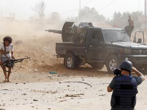 A journalist covers the frontline during clashes between forces loyal to strongman Khalifa Haftar and fighters loyal to the Libyan internationally-recognised Government of National Accord (GNA), south of the Libyan capital Tripoli on May 25,2019.  (AFP/ File Photo)
