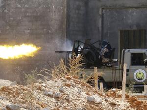 A fighter loyal to the internationally recognised Libyan Government of National Accord (GNA)fires a truck-mounted gun during clashes with forces loyal to strongman Khalifa Haftar in the capital Tripoli's suburb of Ain Zara, on September 7, 2019. (Mahmud TURKIA / AFP)
