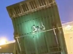 Stowaways were spotted clinging onto the gangway as ferry reached Malaga. (Video Screenshot)