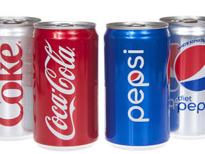 One can of coke and diet coke next to one can of pepsi and diet pepsi. (Shutterstock/ File Photo)