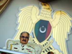 Libyan Strongman Khalifa Haftar attends a military parade in the eastern city of Benghazi, during which he announced a military offensive to take from "terrorists" the city of Derna, the only part of eastern Libya outside his forces' control. (AFP/ File Photo)