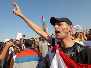 A Kurdish man shouts slogans during a demonstration in Arbil, the capital of the northern Iraqi Kurdish autonomous region (AFP)