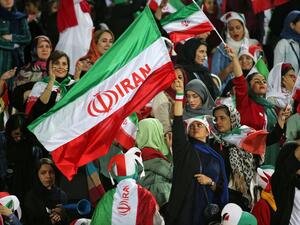 Iranian women cheer ahead of the World Cup Qatar 2022 Group C qualification football match between Iran and Cambodia at the Azadi stadium in the capital Tehran on October 10, 2019. (AFP/File)