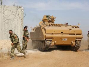 Pro-Turkish Syrian fighters drive an armoured personnel carrier across the border into Syria as they take part in an offensive against Kurdish-controlled areas in northeastern Syria launched by the Turkish military, on October 11, 2019. (AFP/ File Photo)