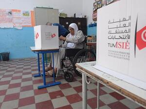 A Tunisian voter casts her ballot at a polling station in the capital Tunis on October 13, 2019 during the second round of the presidential election. Tunisians began voting today in a presidential runoff pitting conservative law professor Kais Saied against media magnate Nabil Karoui, who was released from prison just days earlier. (Fethi Belaid / AFP)