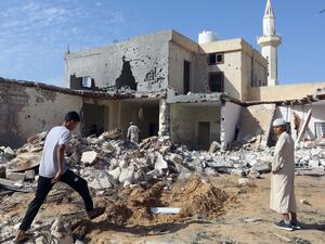 Libyans check the site of an air strike in which three children were killed and others wounded on the southern outskirts of the capital Tripoli on October 14, 2019. (AFP/ File Photo)