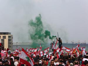 Lebanese protesters wave national flags during a rally in downtown Beirut on October 20, 2019, on the fourth day of demonstrations against tax increases and official corruption. (AFP/ File Photo)