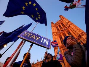 Banners, Union and EU flags are displayed outside the Houses of Parliament in London on October 22, 2019, as MPs debate the second reading of the Government's European Union (Withdrawal Agreement) Bill. (AFP/ File Photo)