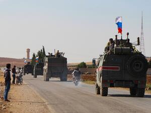 A convoy of Russian military vehicles drives toward the northeastern Syrian city of Kobane on October 23, 2019. Russian forces in Syria headed for the border with Turkey today to ensure Kurdish fighters pull back after a deal between Moscow and Ankara wrested control of the Kurds' entire heartland. AFP