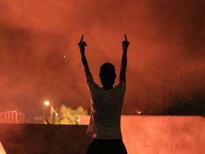 An Iraqi protester gestures with his fingers during an anti-government demonstration in the Shiite shrine city of Karbala, south of Iraq's capital Baghdad on October 27, 2019. Iraq's capital and the country's south have been rocked by a second wave of demonstrations since October 24, with protesters digging in despite tear gas, curfews and violence that has left more than 70 dead. AFP